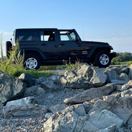 Jeep climbing rocks