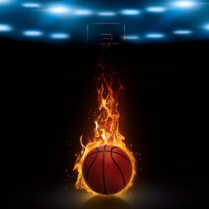 A basketball with flames in front of a dark arena. Player. Team. Teamwork.