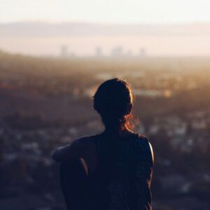 1710072074075 Silhouette of a person, looking over a city. Find your intended path.