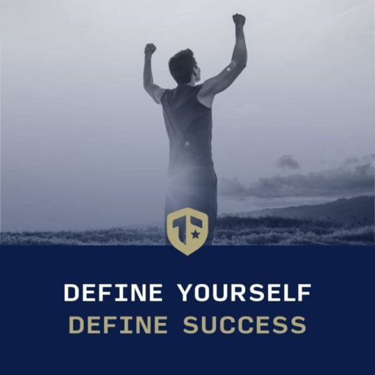 Define yourself. Define success. Logo on a photo of a runner with arms raised to the sky.