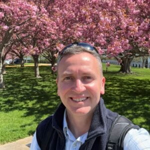1715428503504 Author and Coach, Brandon Jenkins, pictured with cherry blossoms in the background. He writes about following your own script.