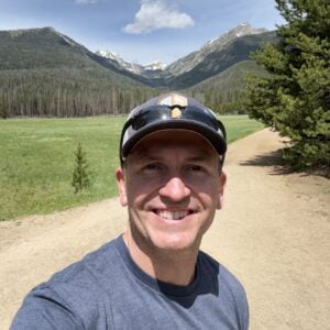 1719945206294 Author and Coach, Brandon Jenkins, walking a path with mountains in the background. He writes about uncovering your Blueprint.