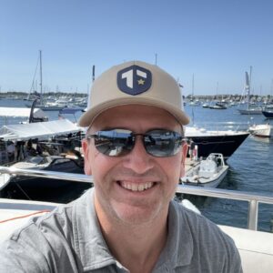 1726436233718 Author, Brandon Jenkins, pictured on a dock in front of a boat. He writes about work life balance, and finding your Blueprint.