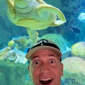 1727461154358 Author, Brandon Jenkins, pictured at an aquarium in front of a sea turtle. He writes about the trait good leaders share.