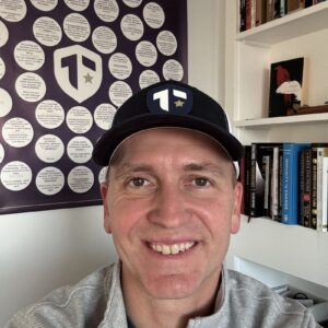1738154539133 Author and Coach, Brandon Jenkins writes about avoiding the I've Always Won trap. Image shows Brandon, wearing a baseball cap and smiling.
