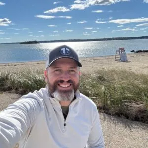 Author and coach Brandon Jenkins writes about go mode and recharging. He is pictured on a sunny day at the beach.
