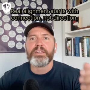 Coach Brandon Jenkins writes about alignment and caring about the mission. He is pictured in his office.