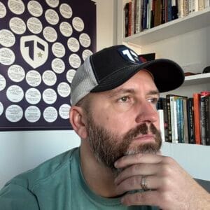 Coach Brandon Jenkins is pictured in his office, in front of his Blueprint. He writes about pressure on leaders, and how they don't have to do it alone.