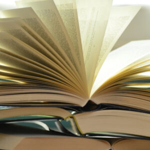 Reading to challenge yourself Stack of three open books