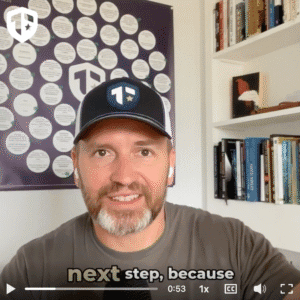 Coach Brandon Jenkins is pictured in his office, wearing a Tier One baseball hat. He speaks about how clarity changes everything.