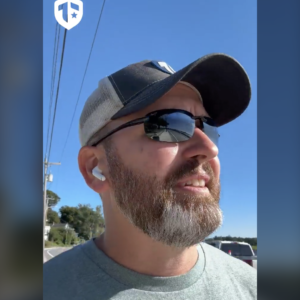 Coach Brandon Jenkins is pictured on a walk on a sunny, clear sky day. He speaks about leadership.