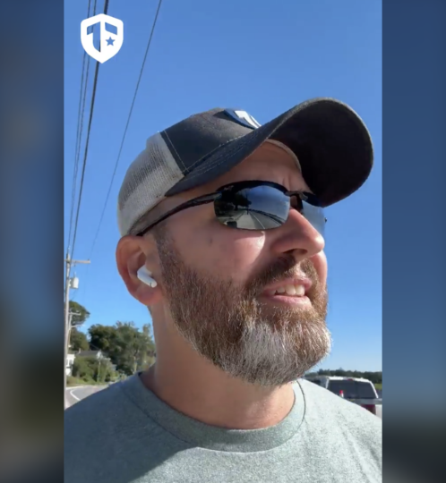 Coach Brandon Jenkins is pictured on a walk on a sunny, clear sky day. He speaks about leadership.