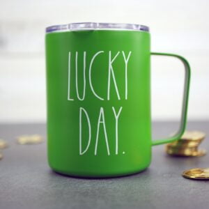 Lucky Day mug with gold coins scattered around.