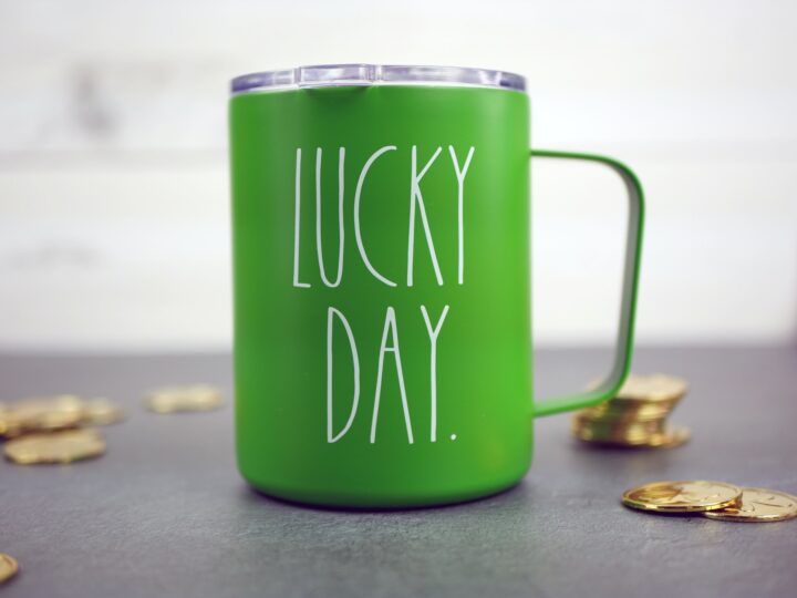Lucky Day mug with gold coins scattered around.