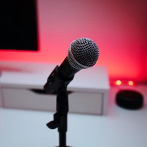 james-mckinven-YttqtV6P5W8-unsplash-2 Microphone with desk and red light in background. Speaking your truth.