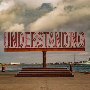 zuzana-ruttkay-1kslaBtXBk8-unsplash Sign above steps reads "understanding."